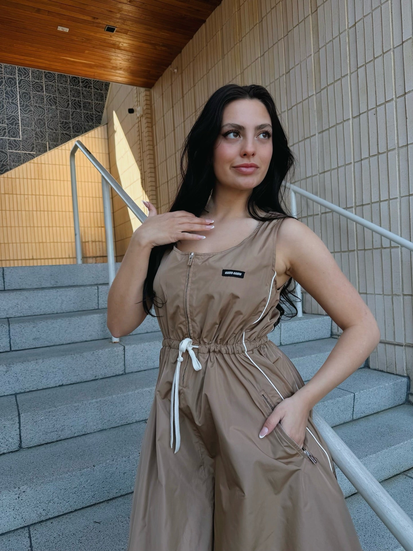 female model wearing brown miu miu dress from new last week collection
