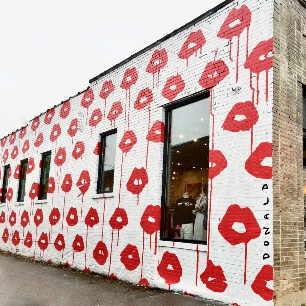 View of the Drippy Lips Donald Robertson Mural on the side of the UAL store on 21st Avenue in Nashville, Tennessee